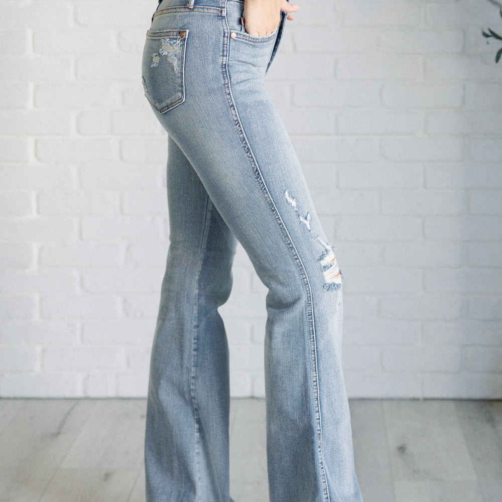 
                      
                        Caroline Mid Rise Control Top Distressed Flare Jeans
                      
                    